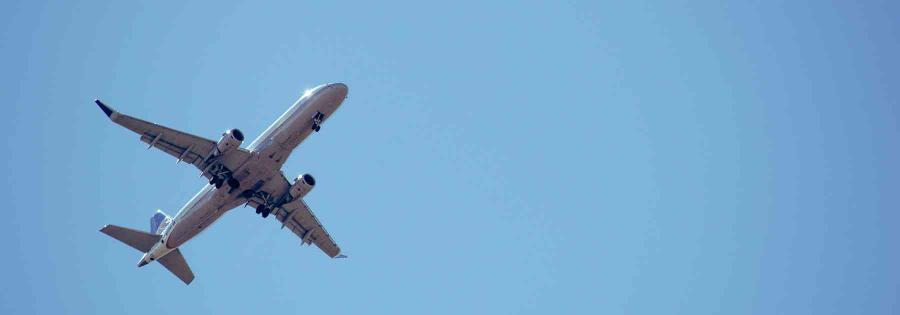 plane flying against a blue sky