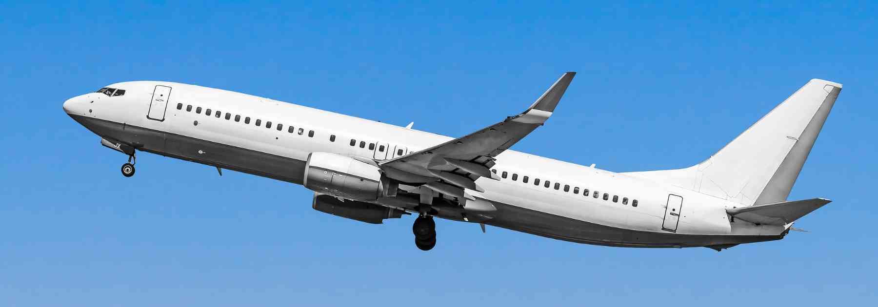 plane flying against a blue sky
