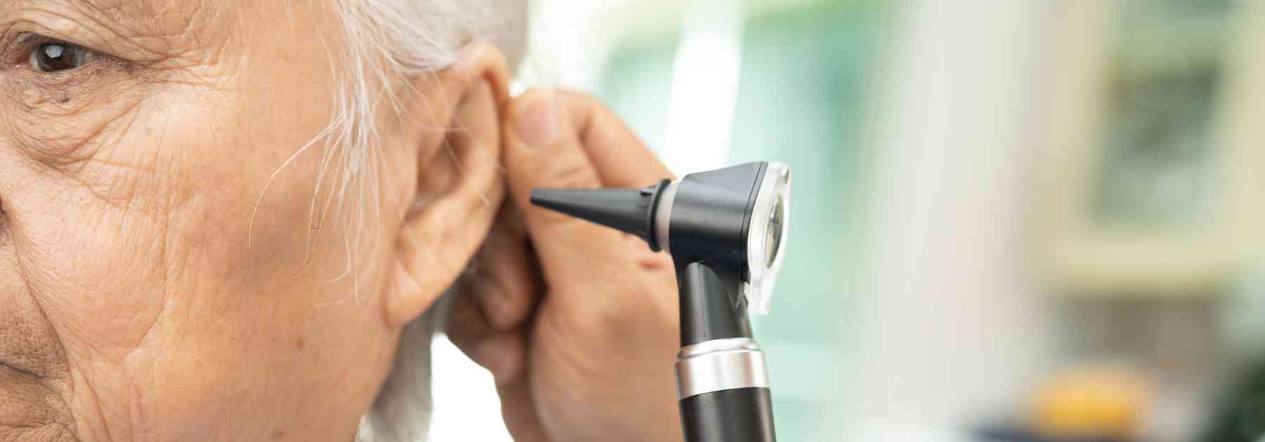 doctor examining patient's ear