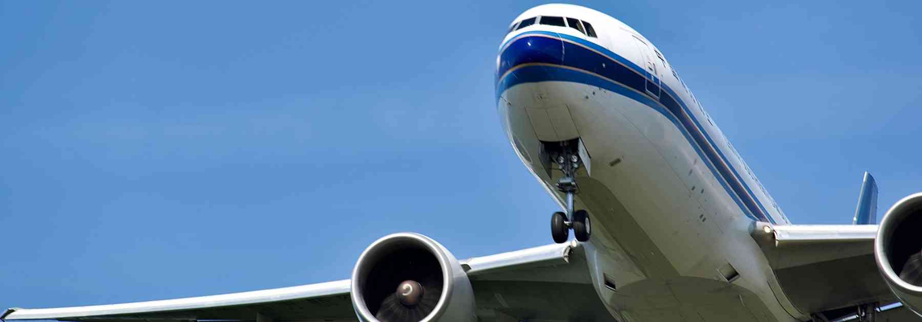 front of plane flying in blue sky