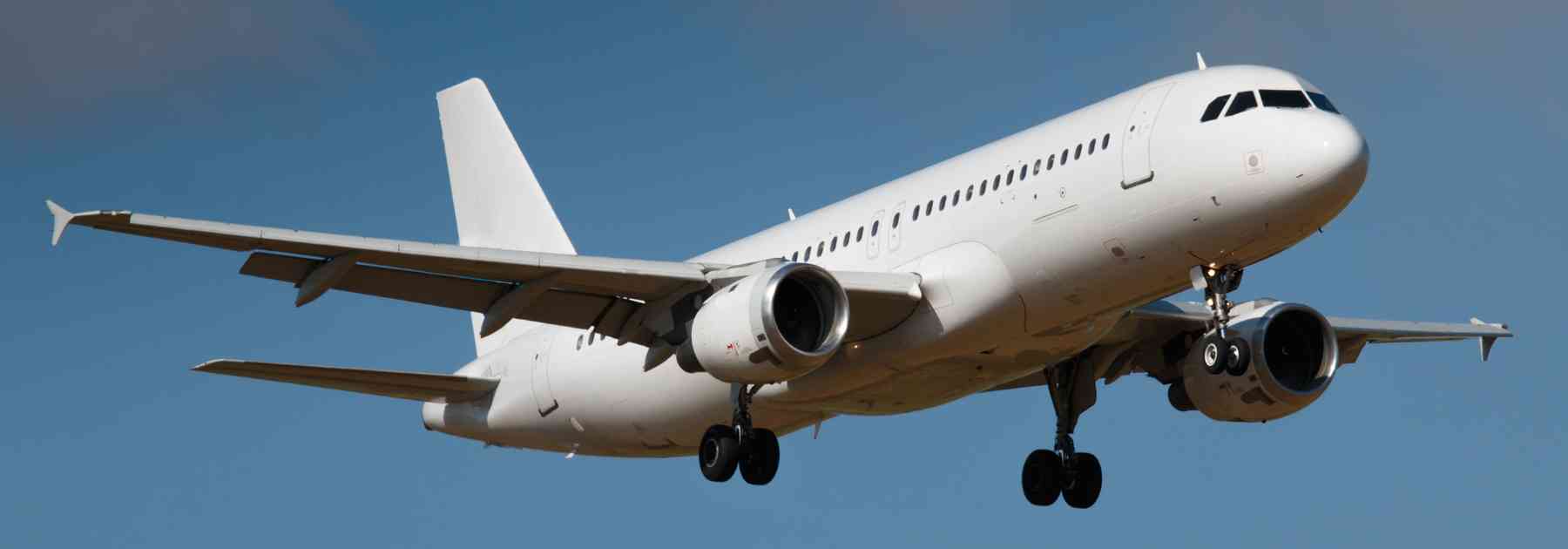 plane flying in blue sky