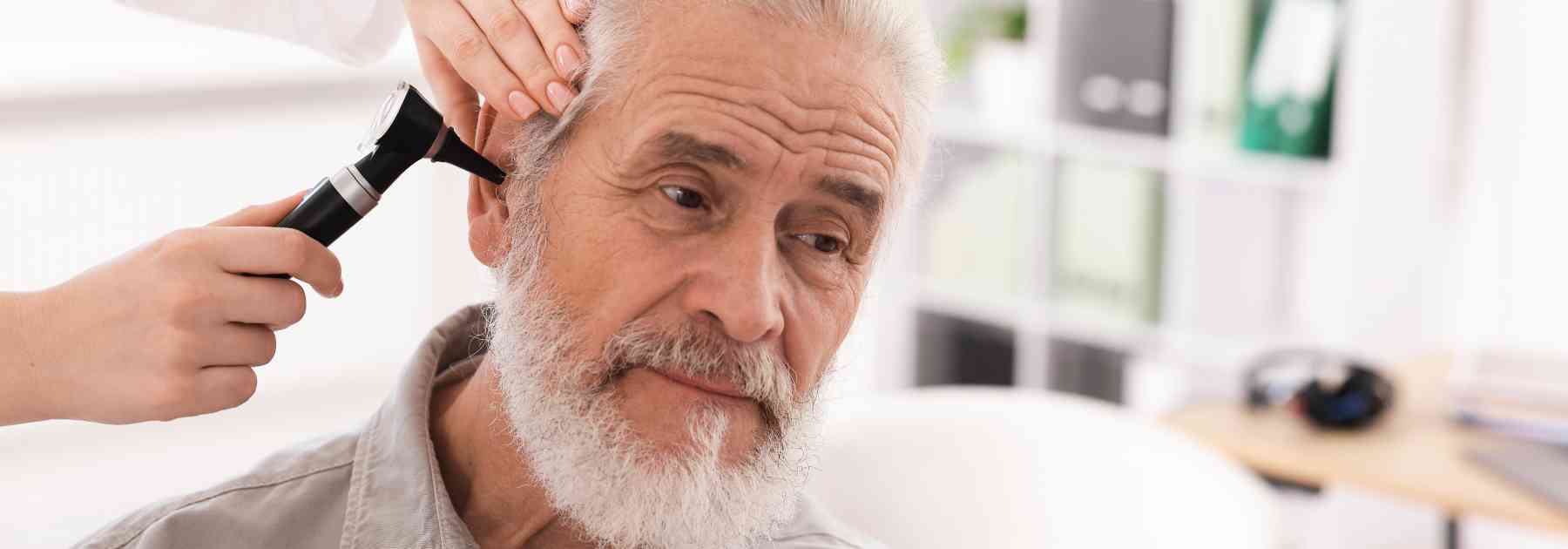 male patient having his ear examined