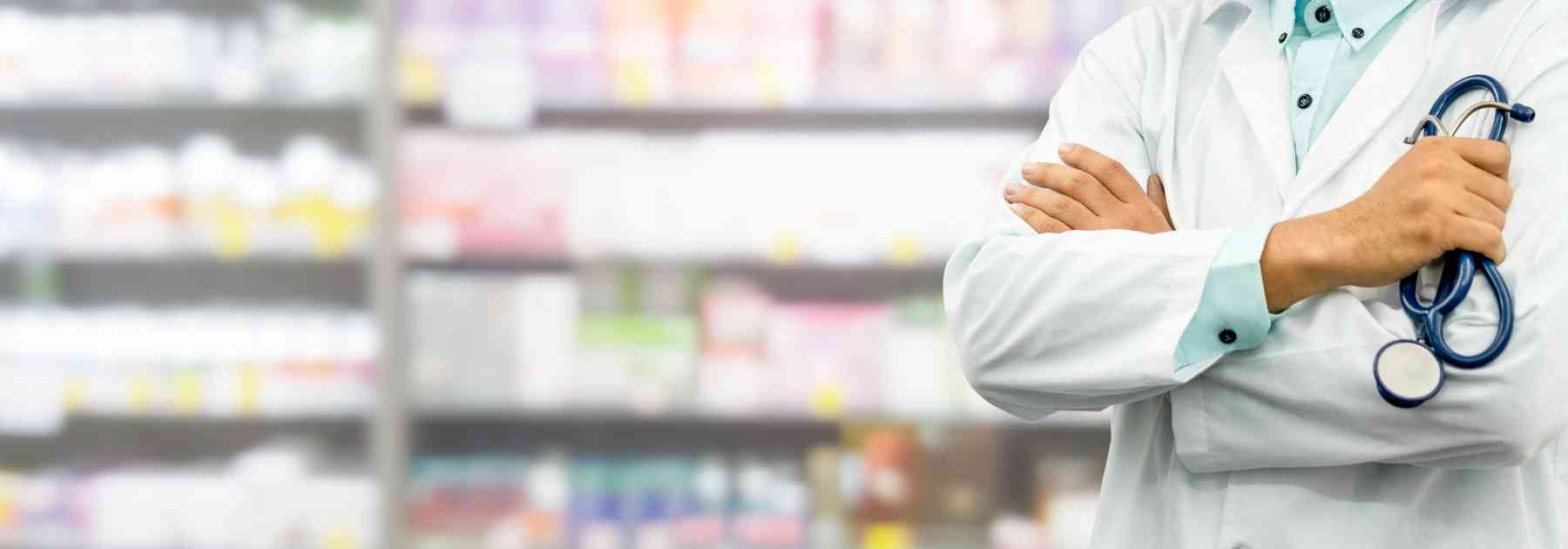 male pharmacist folding his arms