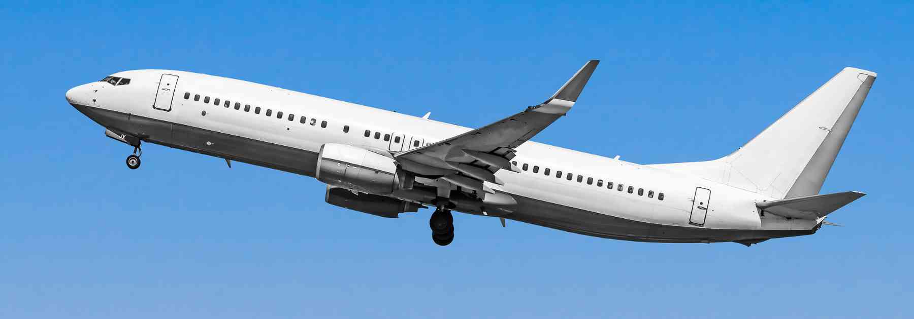 plane flying in blue sky