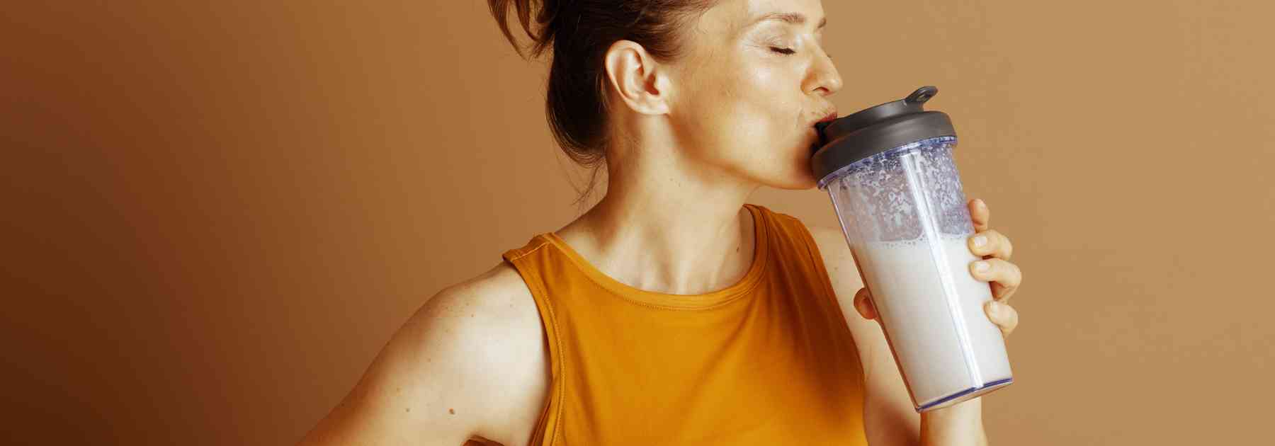 woman drinking protein shake