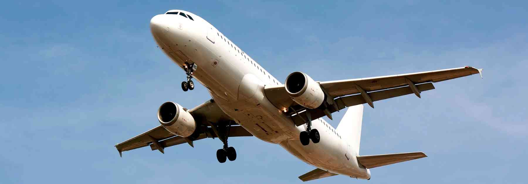 plane flying in blue sky