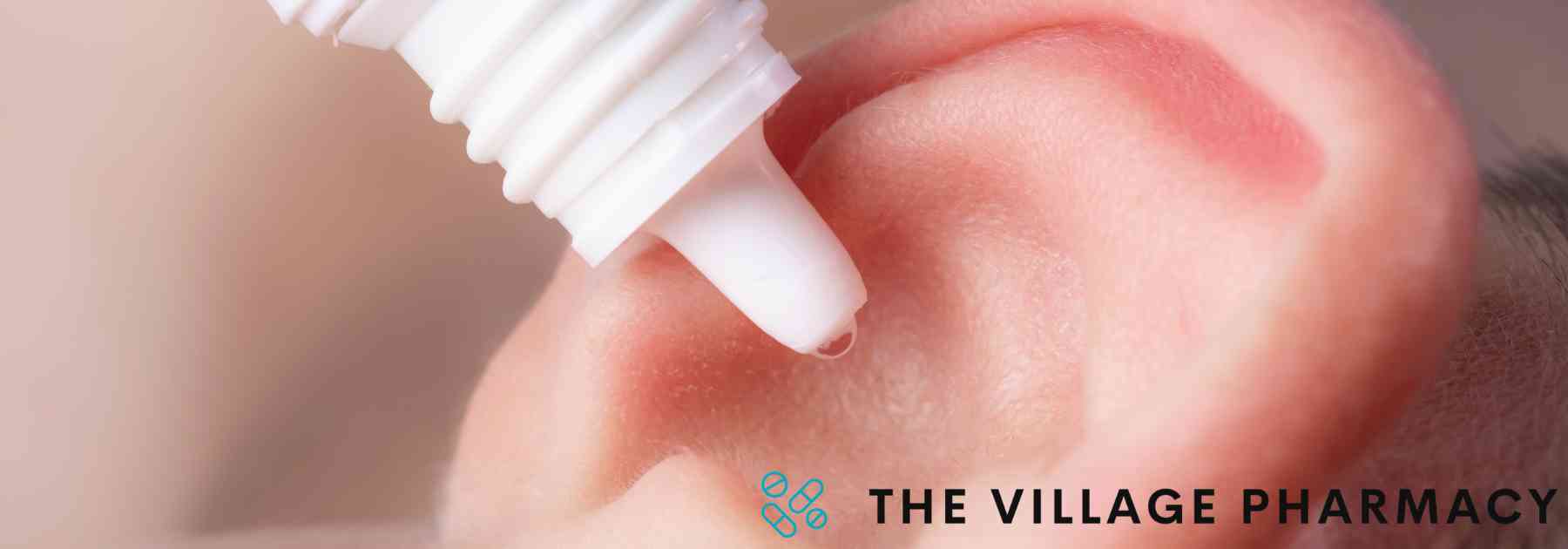 close-up of person using ear drops
